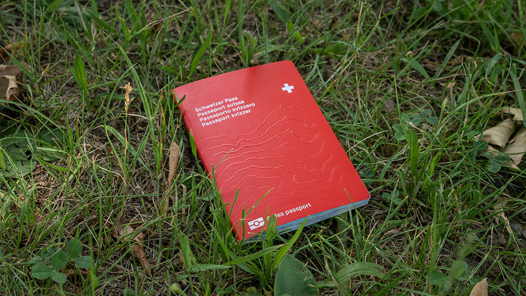 The Swiss passport fallen on the lawn