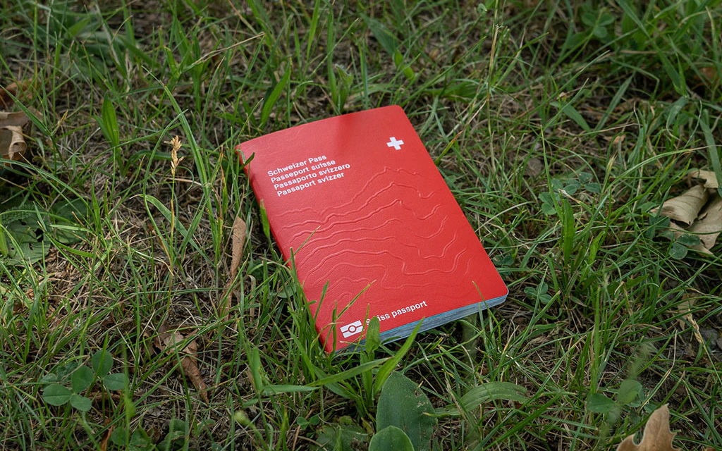 The Swiss passport fallen on the lawn